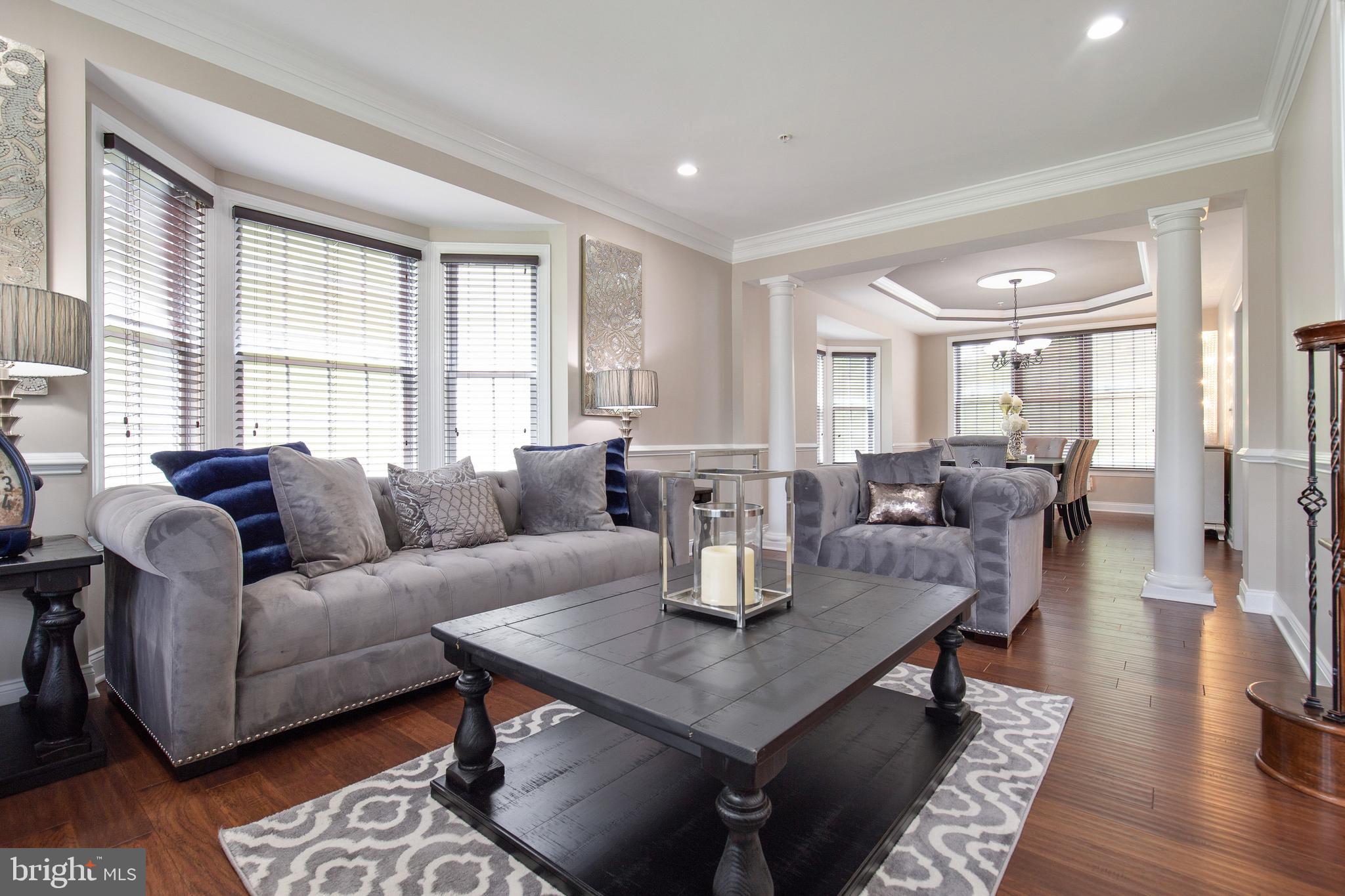 4201 Rolling Paddock Drive Upper Marlboro, MD 20772 - Photo 15 of 62 a living room with furniture and a large window