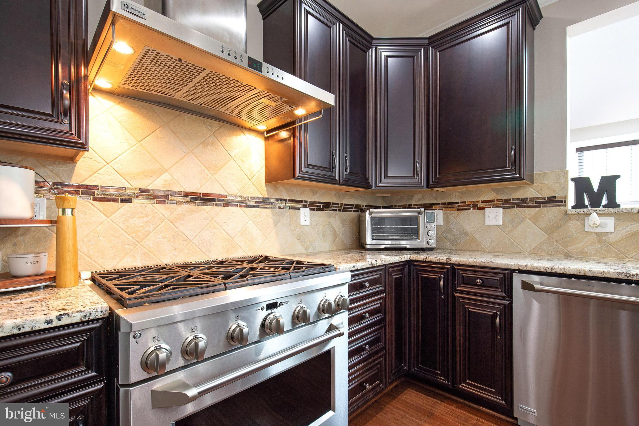 4201 Rolling Paddock Drive Upper Marlboro, MD 20772 - Photo 18 of 62 a kitchen with a stove and a sink