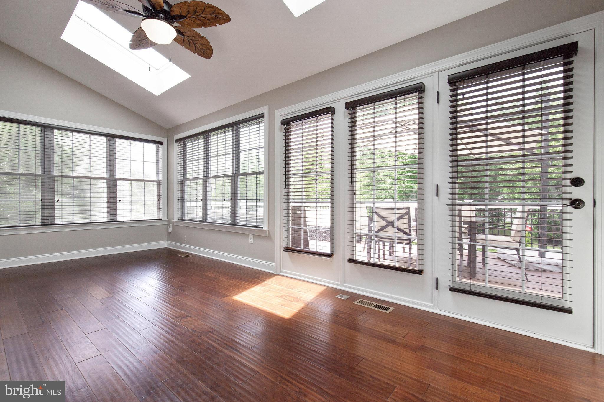 4201 Rolling Paddock Drive Upper Marlboro, MD 20772 - Photo 27 of 62 a view of an empty room with wooden floor and a window