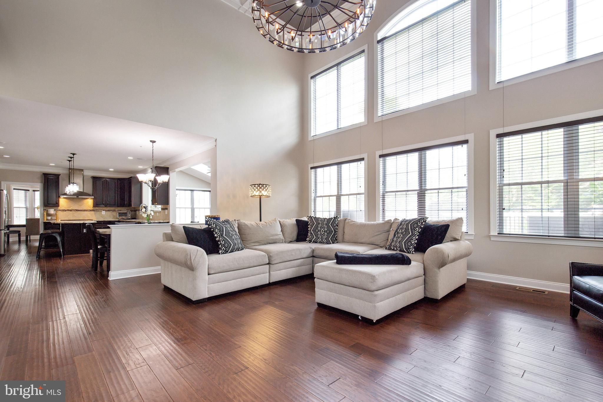 4201 Rolling Paddock Drive Upper Marlboro, MD 20772 - Photo 29 of 62 a living room with furniture and a large window