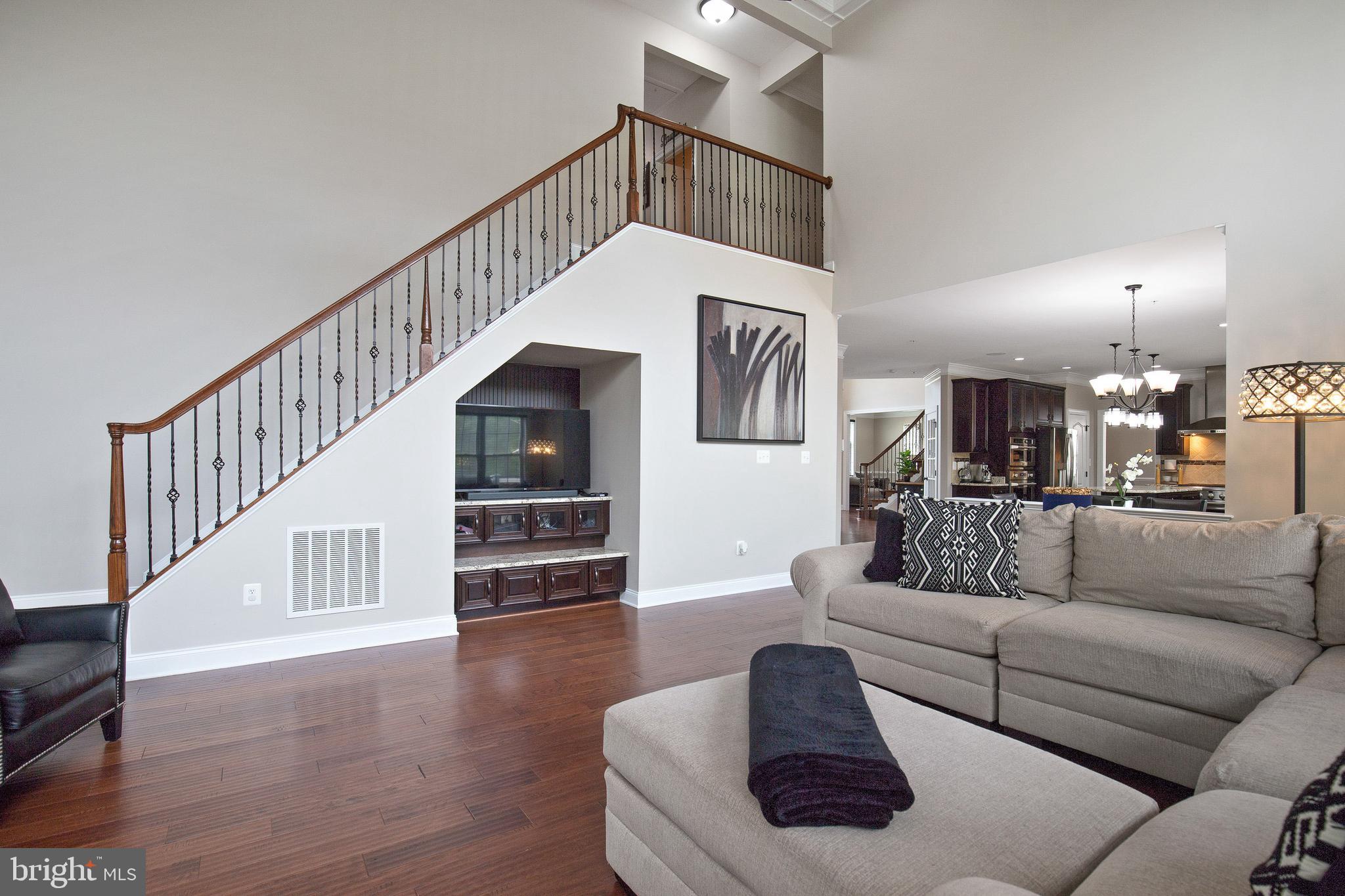 4201 Rolling Paddock Drive Upper Marlboro, MD 20772 - Photo 31 of 62 a living room with furniture and a book shelf