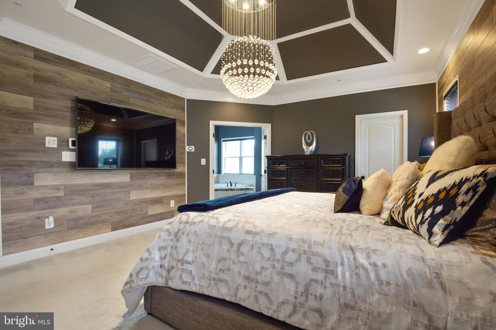 4201 Rolling Paddock Drive Upper Marlboro, MD 20772 - Photo 32 of 62 a bedroom with a bed and a large mirror