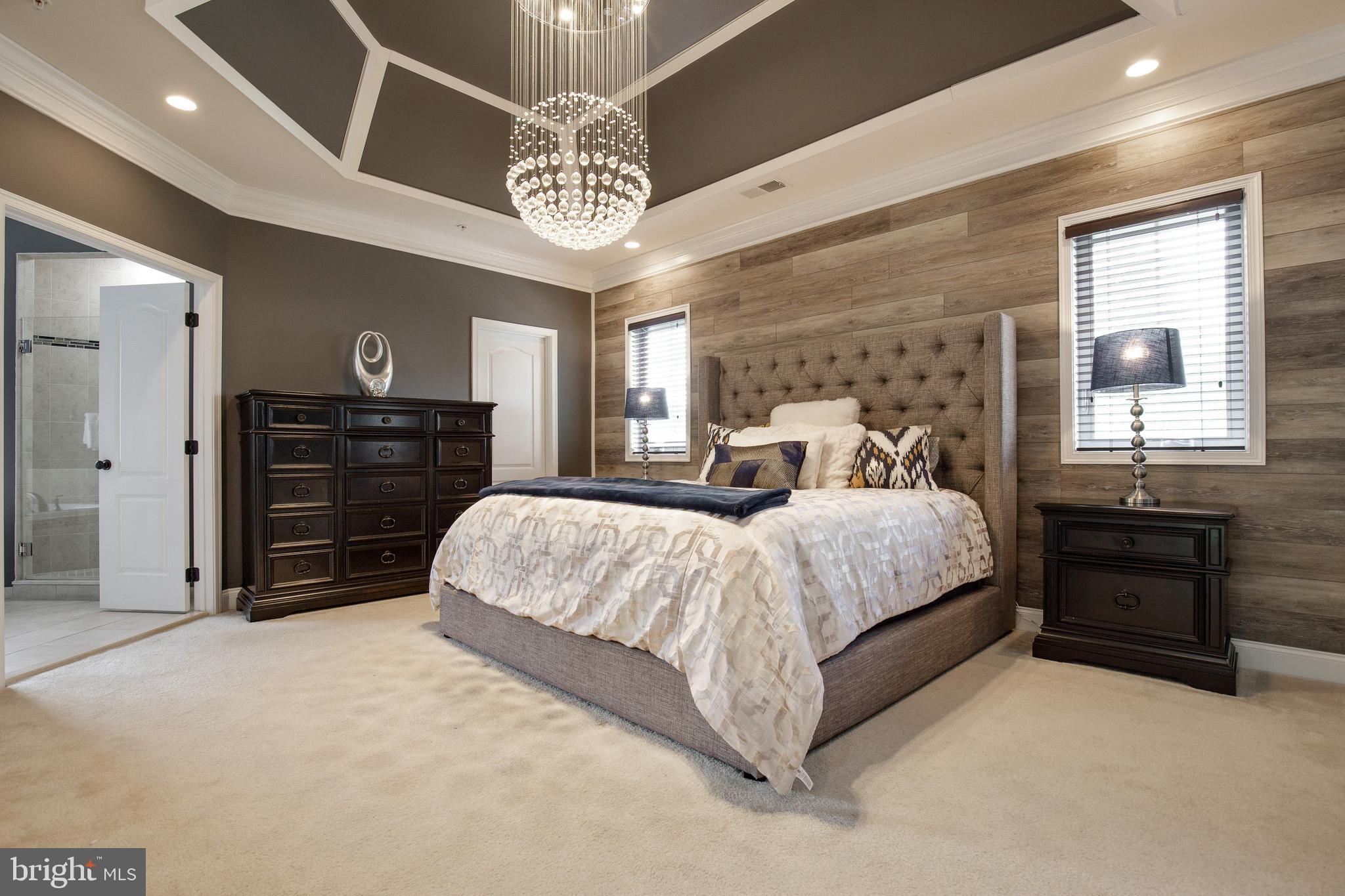 4201 Rolling Paddock Drive Upper Marlboro, MD 20772 - Photo 33 of 62 a spacious bedroom with a bed and a dresser