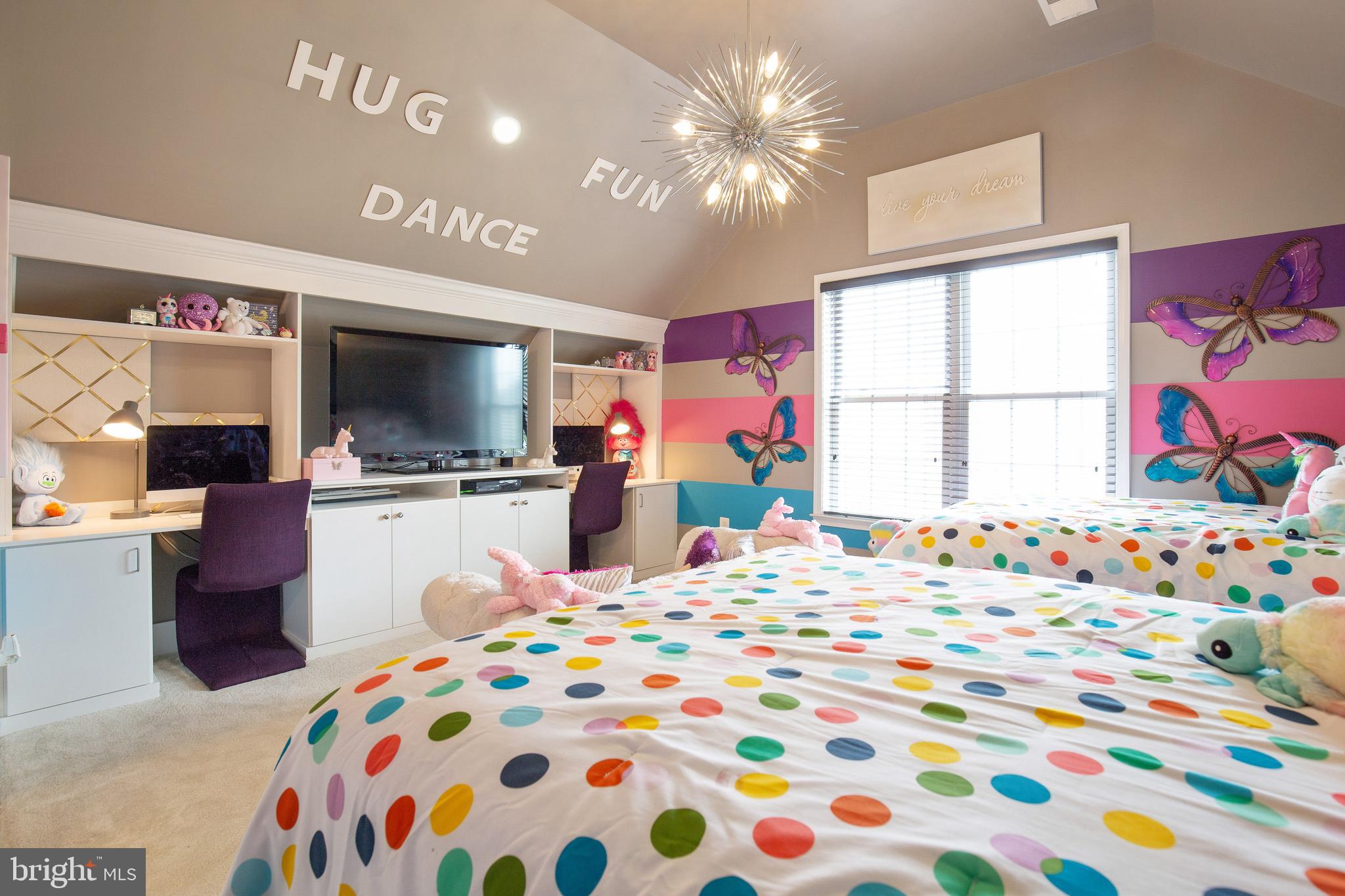 4201 Rolling Paddock Drive Upper Marlboro, MD 20772 - Photo 40 of 62 a bedroom with a bed and a flat screen tv