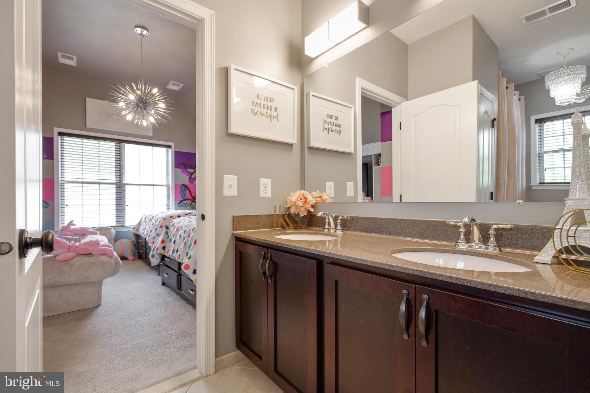 4201 Rolling Paddock Drive Upper Marlboro, MD 20772 - Photo 41 of 62 a en suite bathroom with a sink double vanity and mirror