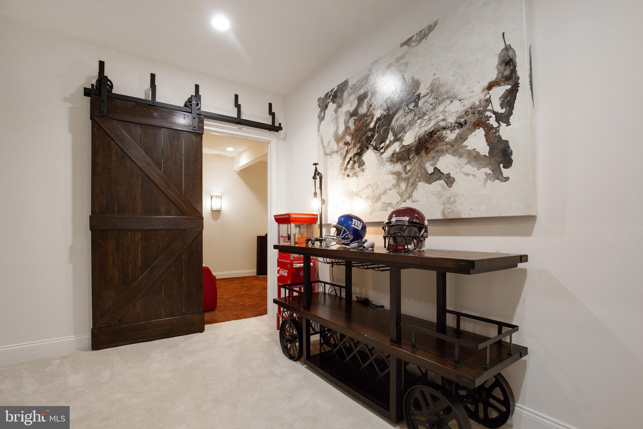 4201 Rolling Paddock Drive Upper Marlboro, MD 20772 - Photo 48 of 62 a view of a hallway with seating space and stainless steel appliances