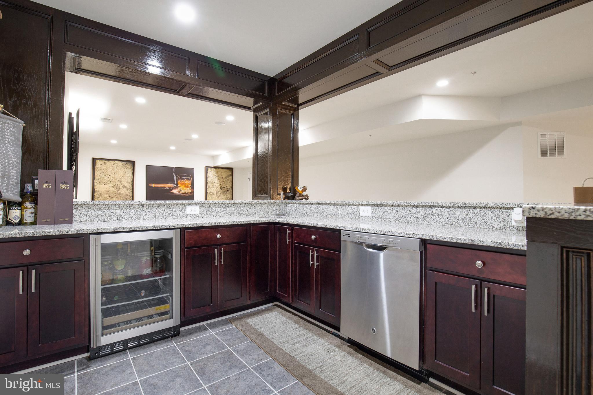 4201 Rolling Paddock Drive Upper Marlboro, MD 20772 - Photo 51 of 62 a bathroom with a granite countertop sink and cabinets
