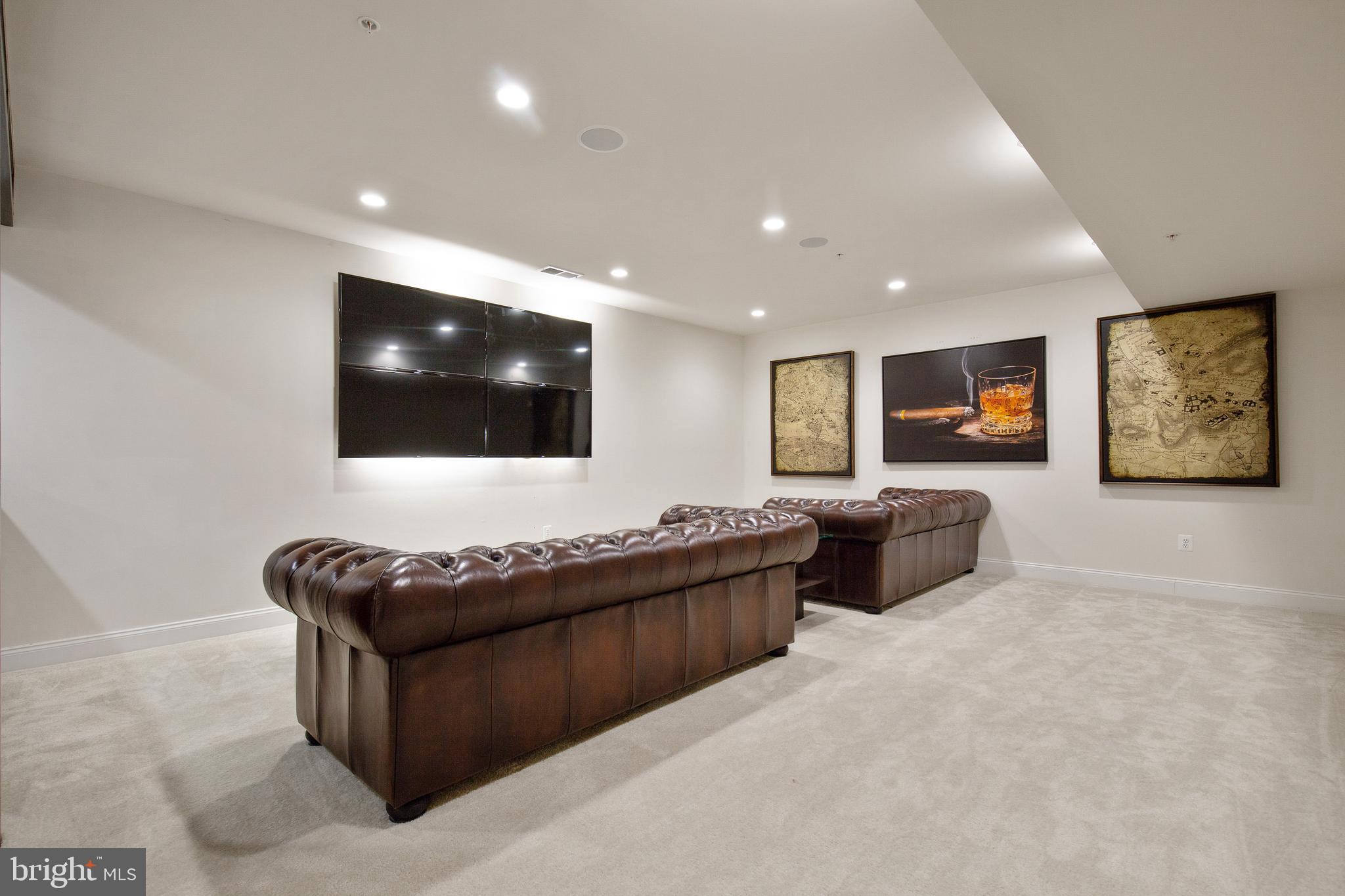 4201 Rolling Paddock Drive Upper Marlboro, MD 20772 - Photo 53 of 62 a living room with furniture and a flat screen tv