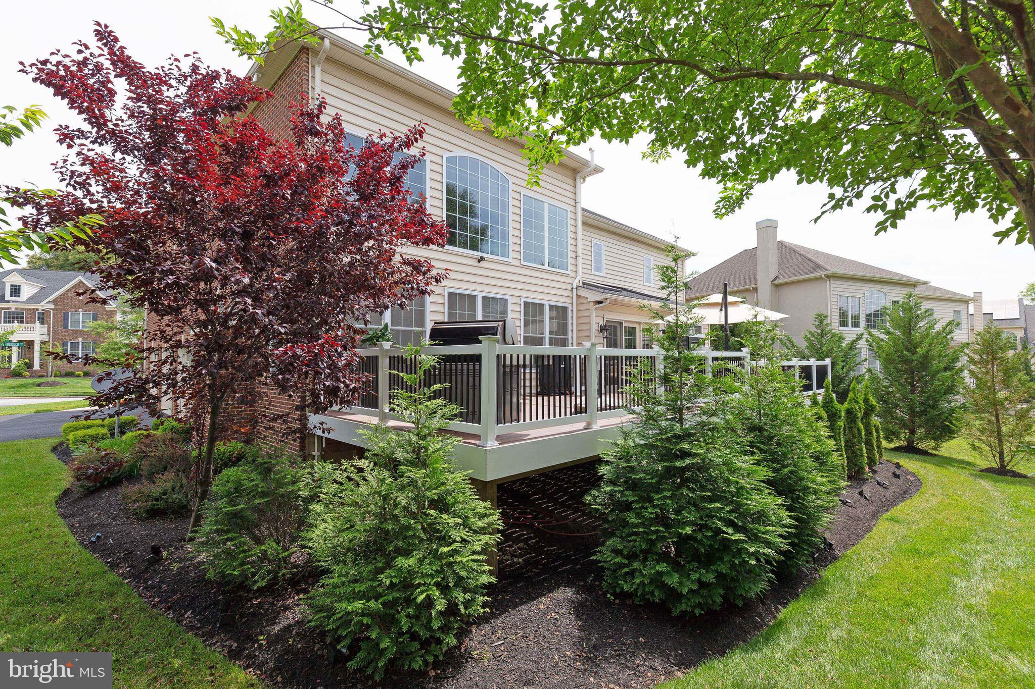 4201 Rolling Paddock Drive Upper Marlboro, MD 20772 - Photo 58 of 62 a view of a house with a yard and potted plants