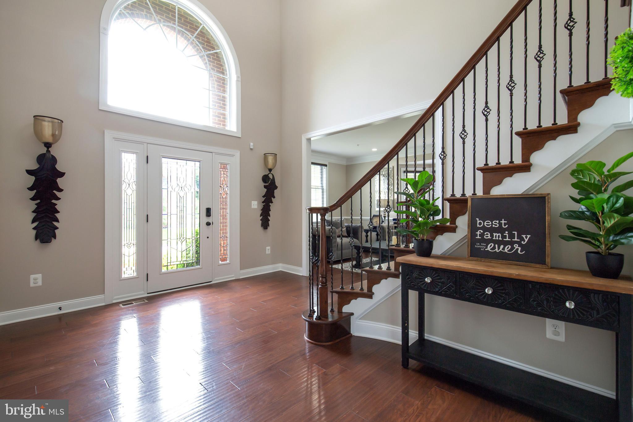 4201 Rolling Paddock Drive Upper Marlboro, MD 20772 - Photo 6 of 62 a view of entryway with wooden floor and stairs