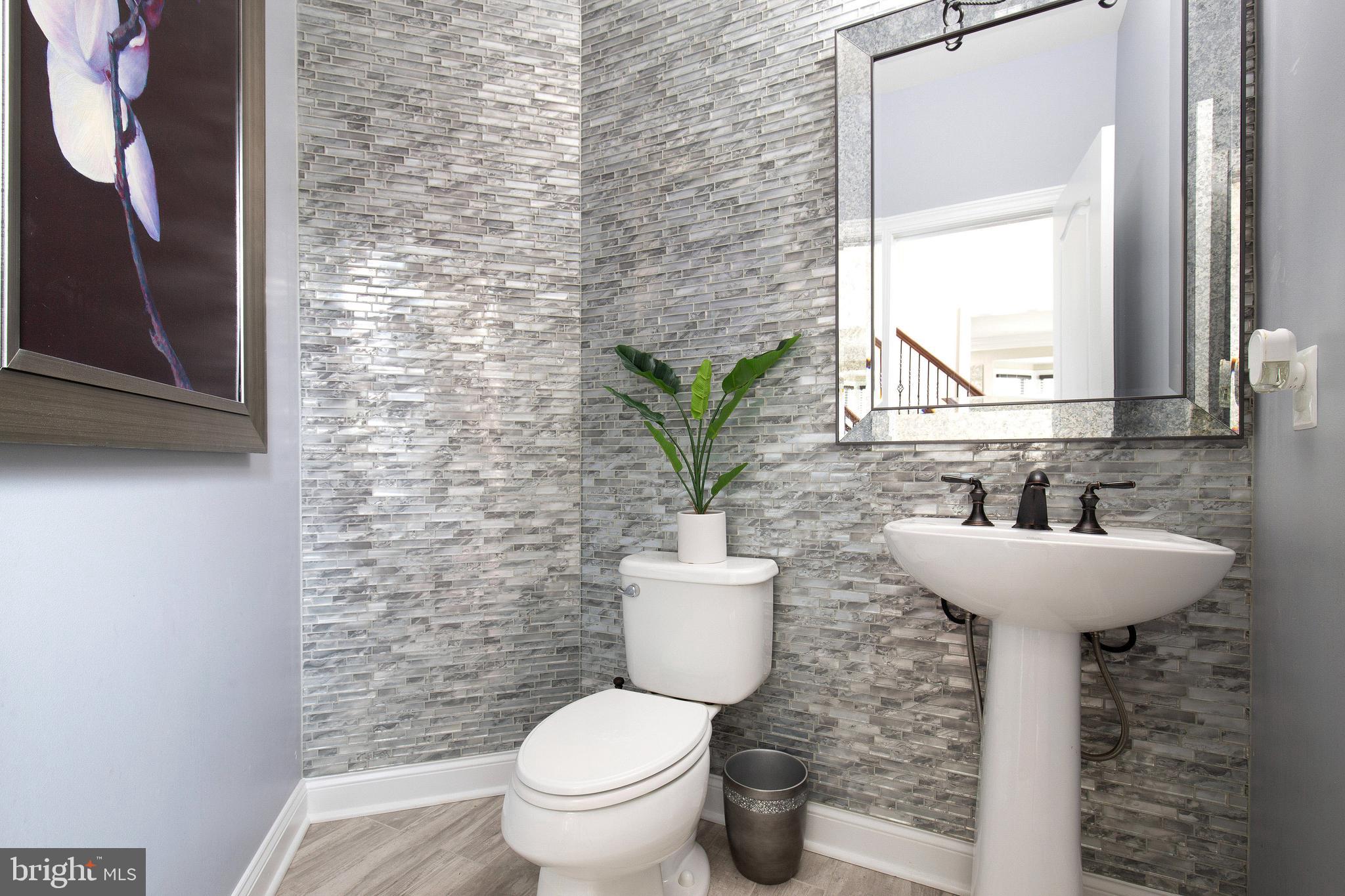 4201 Rolling Paddock Drive Upper Marlboro, MD 20772 - Photo 9 of 62 a bathroom with a sink and a toilet