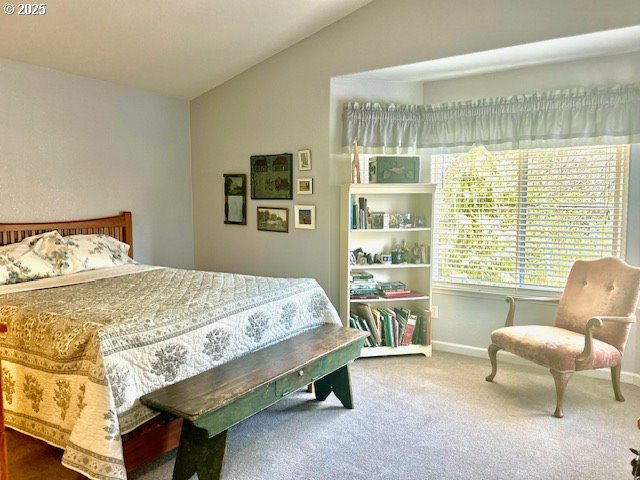 15 Mariners Lane Florence, OR 97439 - Photo 19 of 40 a bedroom with a bed and a couch