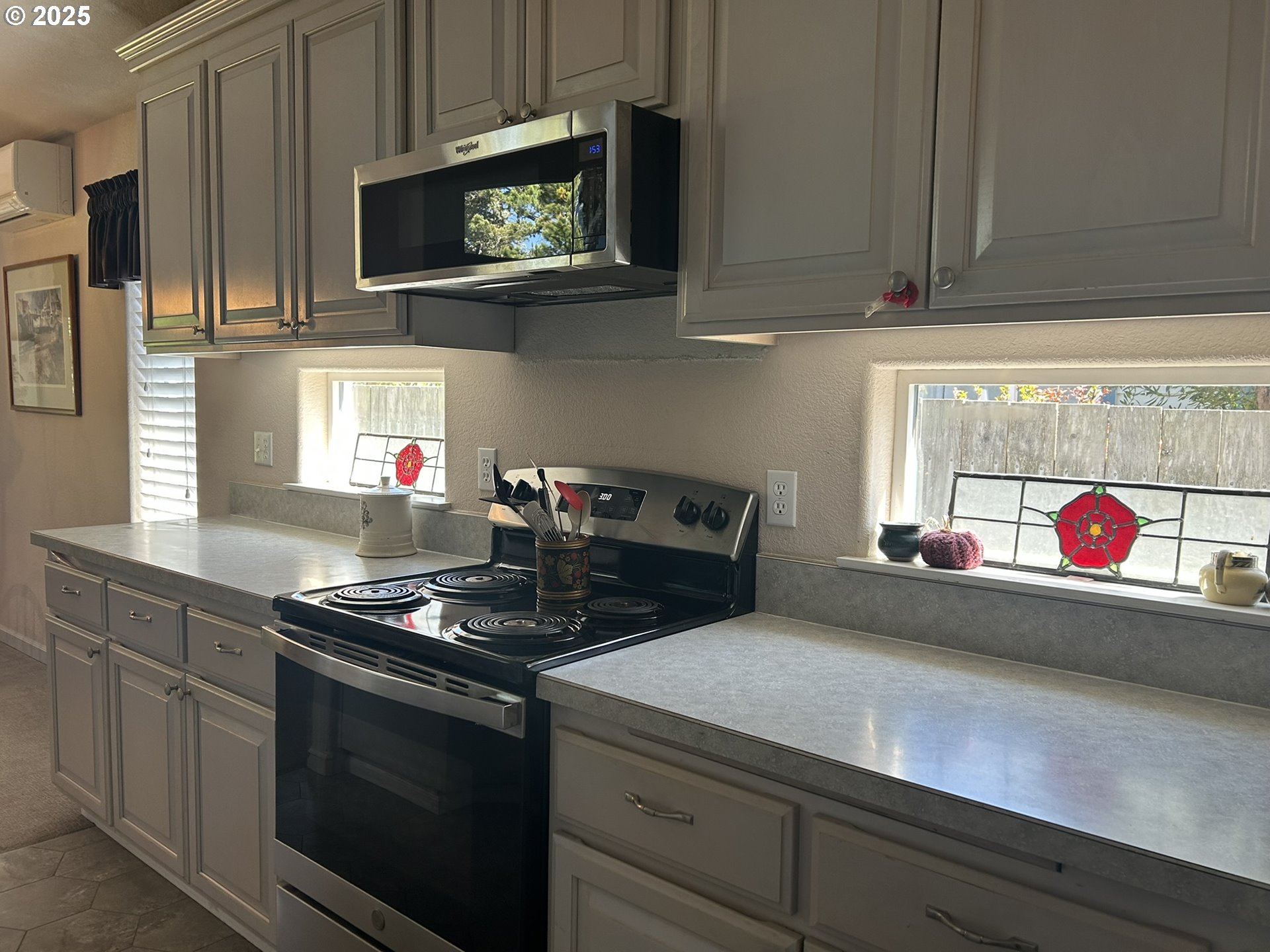 15 Mariners Lane Florence, OR 97439 - Photo 26 of 40 a kitchen with stainless steel appliances granite countertop white cabinets and a stove