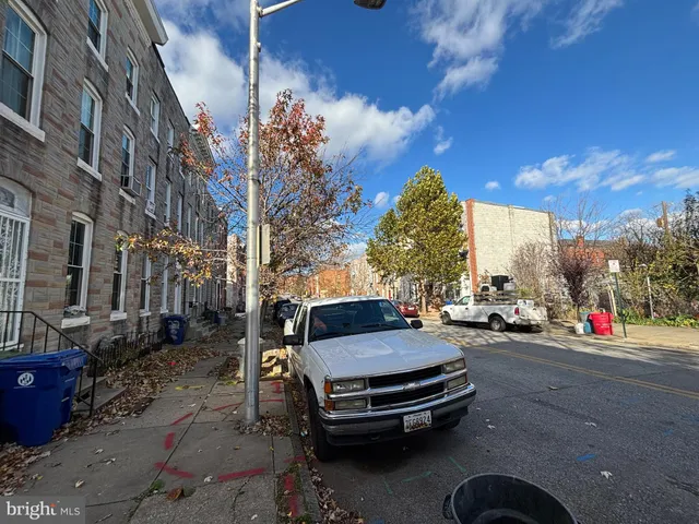a view of street with parked cars