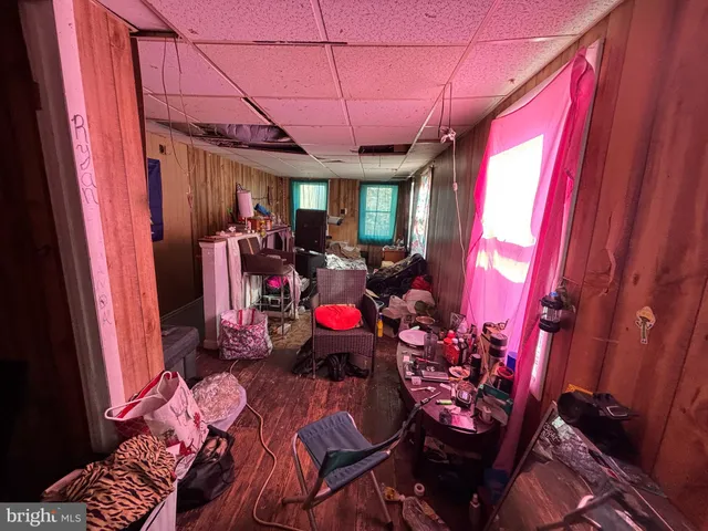 a view of a room with furniture and a window