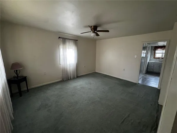 a view of empty room with windows