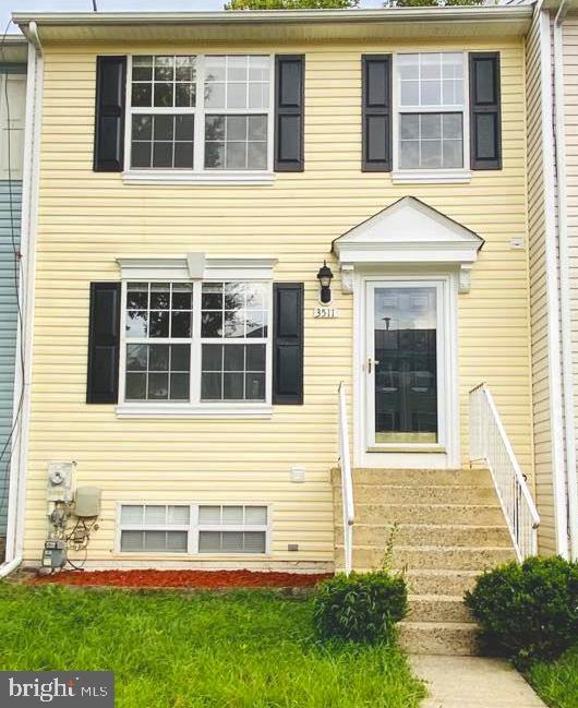a view of a brick house with a large windows