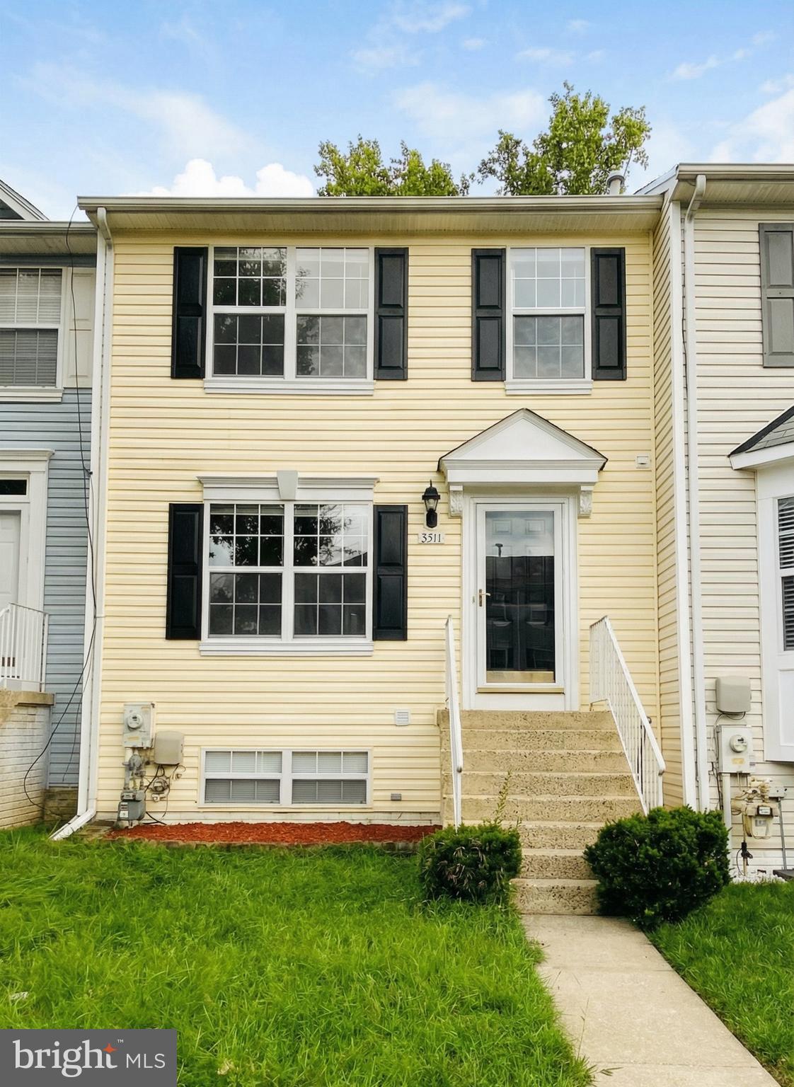 a front view of a house with a yard