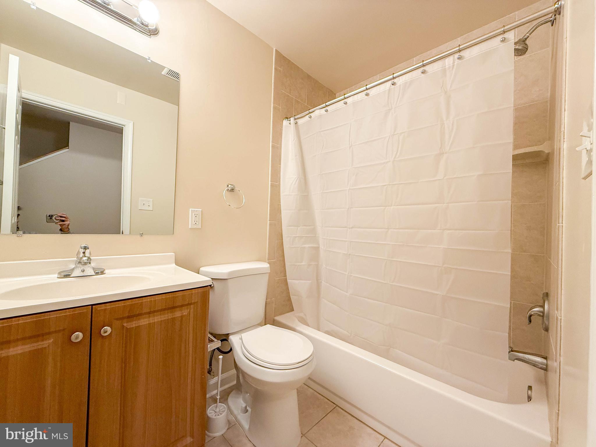 3511 Orchard Shade Road Randallstown, MD 21133 - Photo 14 of 27 a bathroom with a sink a toilet and shower