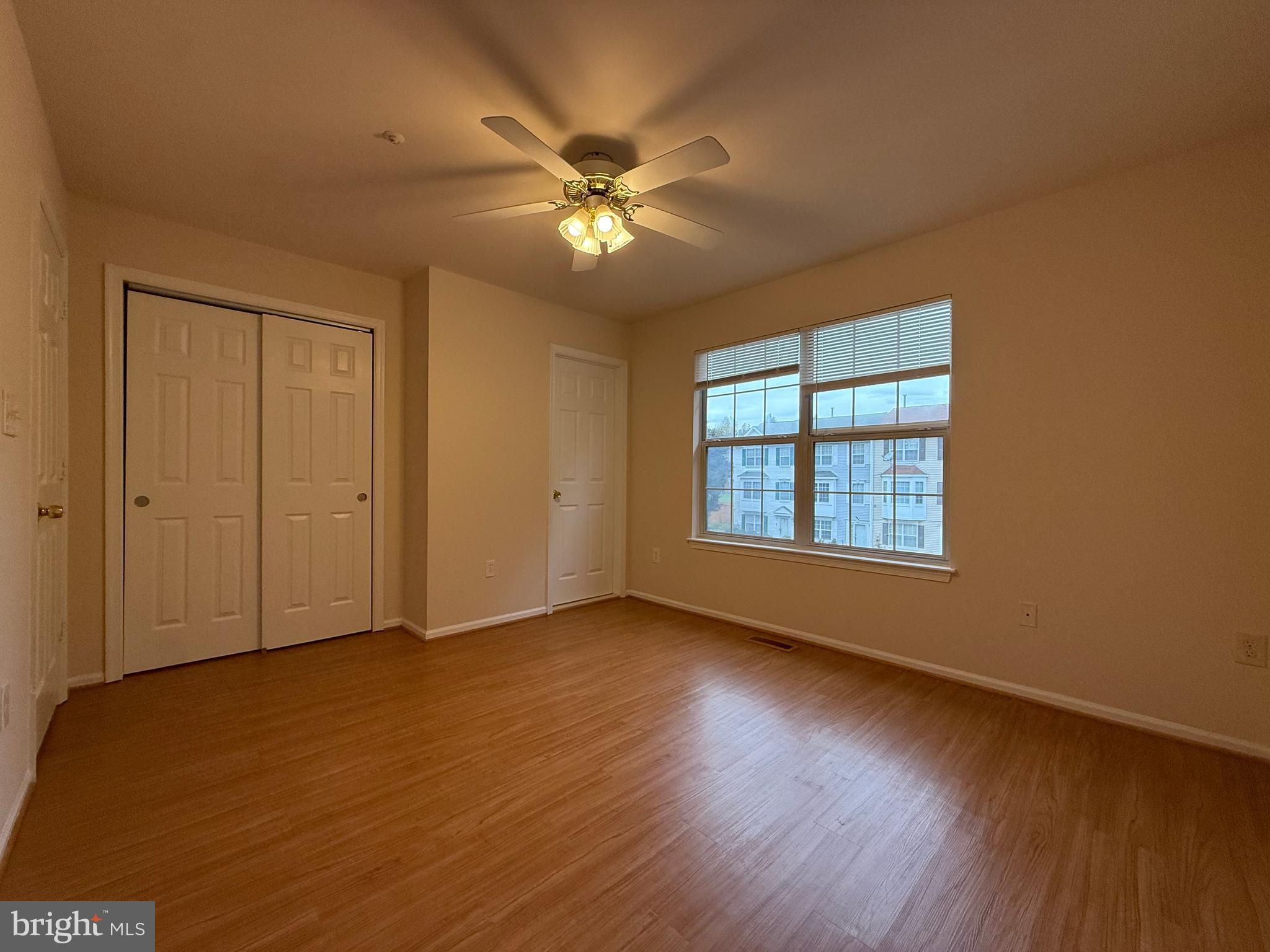 3511 Orchard Shade Road Randallstown, MD 21133 - Photo 16 of 30 a view of an empty room with wooden floor and a window