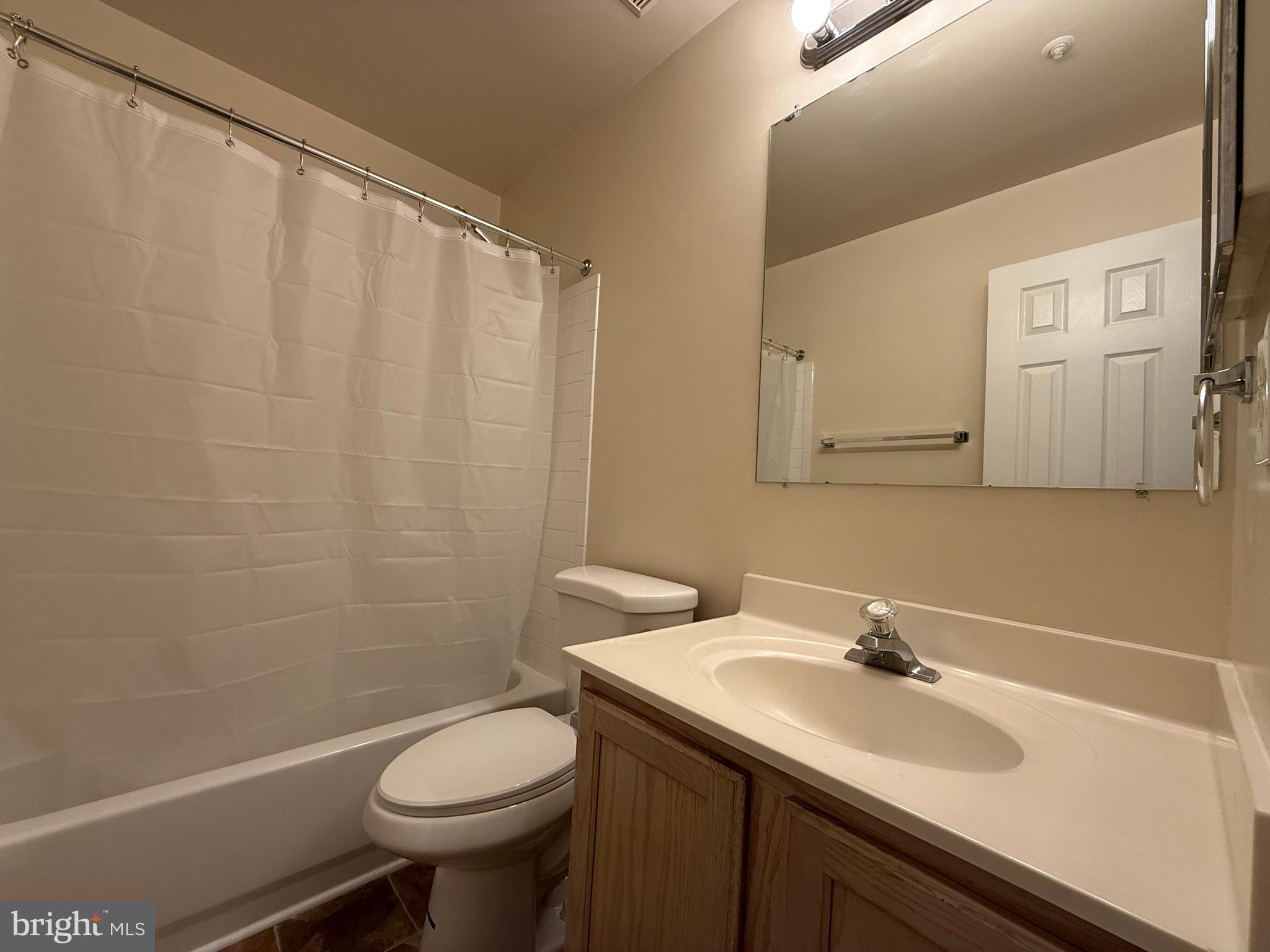3511 Orchard Shade Road Randallstown, MD 21133 - Photo 23 of 30 a bathroom with a sink toilet and a mirror