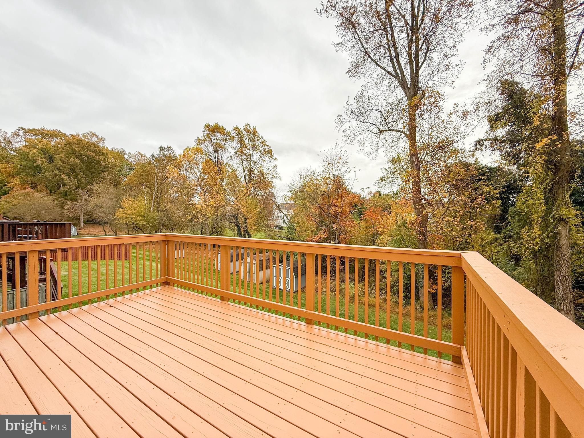 3511 Orchard Shade Road Randallstown, MD 21133 - Photo 27 of 27 a view of balcony with wooden floor and fence