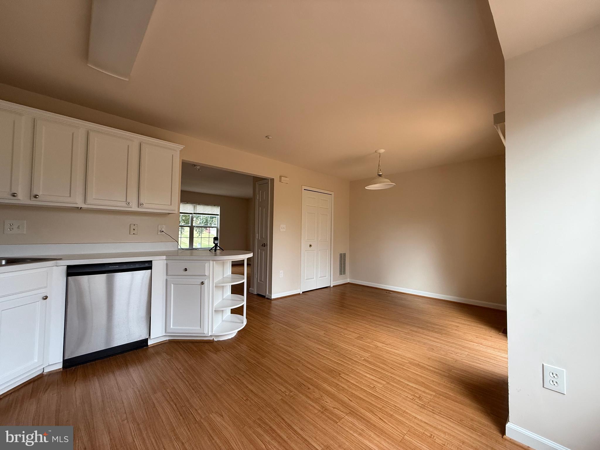 3511 Orchard Shade Road Randallstown, MD 21133 - Photo 3 of 30 a kitchen with granite countertop white cabinets and white appliances
