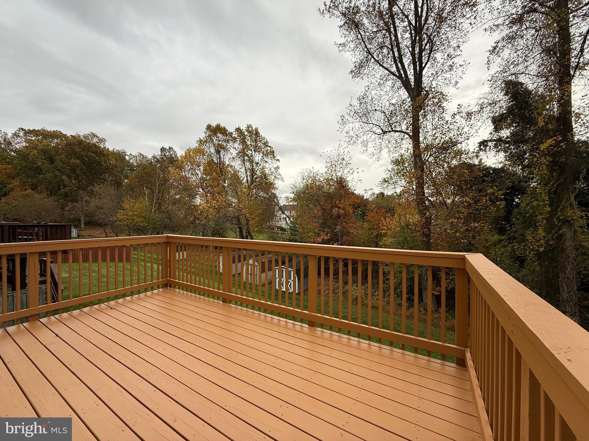 3511 Orchard Shade Road Randallstown, MD 21133 - Photo 7 of 30 a view of balcony with wooden floor and fence