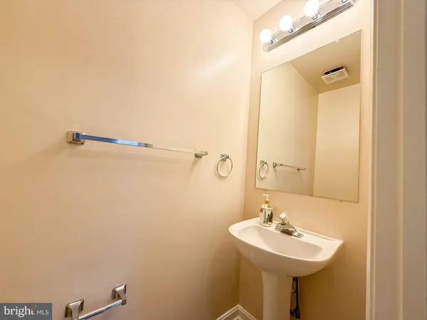 a bathroom with a sink a mirror and shower