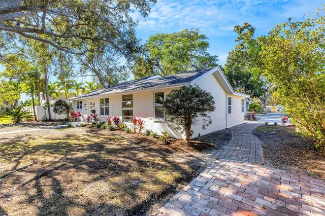 a view of room with window and wooden floor