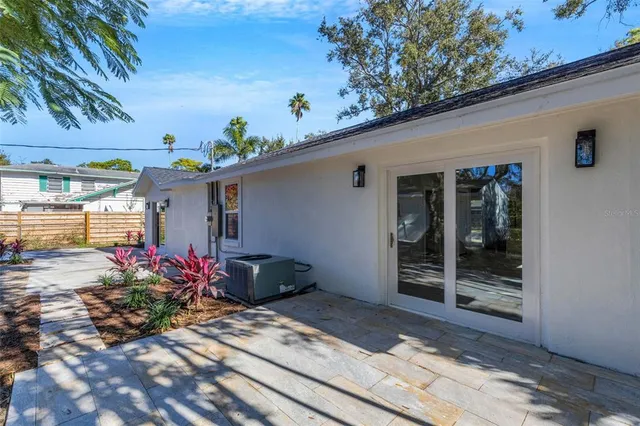 a view of a house with a tree