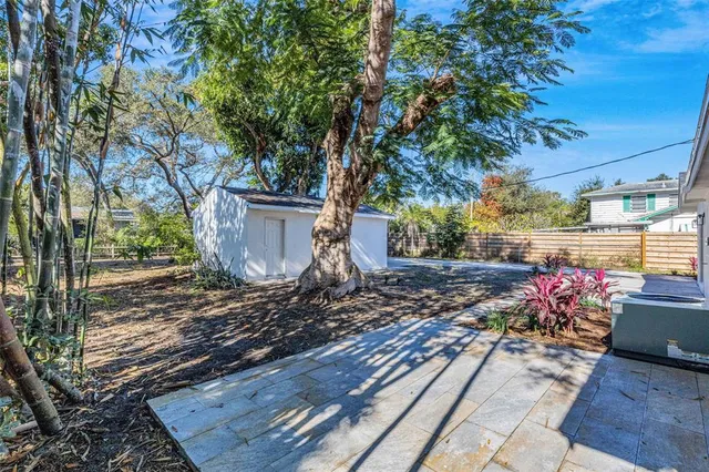 a view of a house with a yard and garage