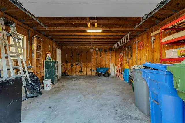 an aerial view of residential house with outdoor space and parking