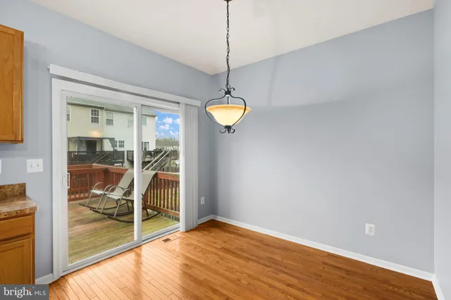 a kitchen with stainless steel appliances granite countertop a sink stove refrigerator and a window