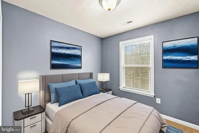 a bedroom with bed and window