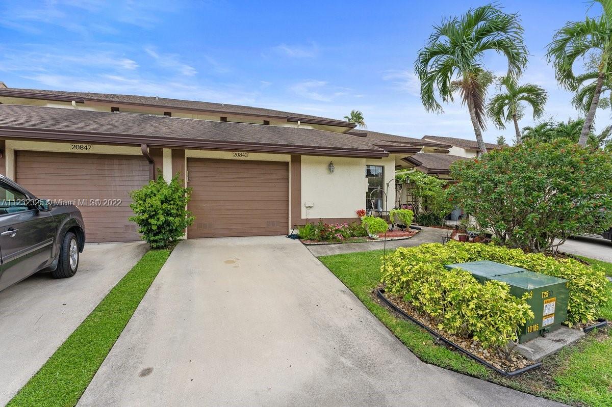 20843 Boca Ridge Drive North Boca Raton, FL 33428 - Photo 5 of 22 a front view of a house with garden