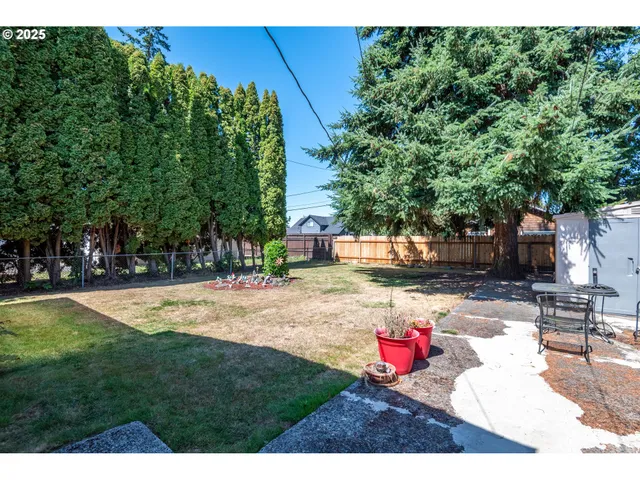 a backyard of a house with yard and outdoor seating