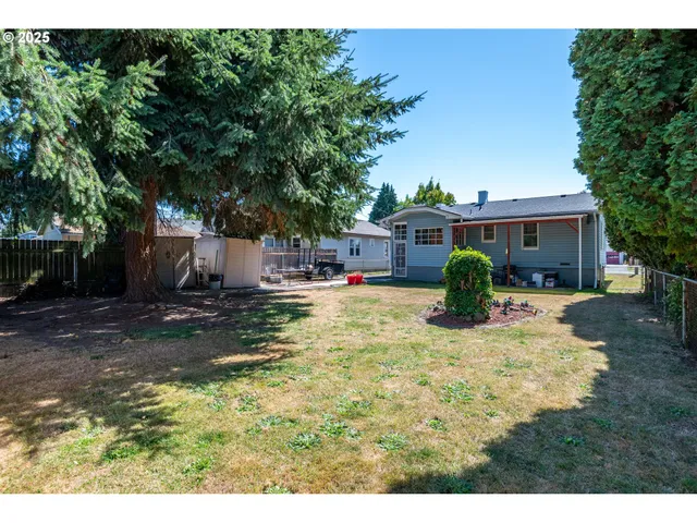 a view of a house with swimming pool and sitting area