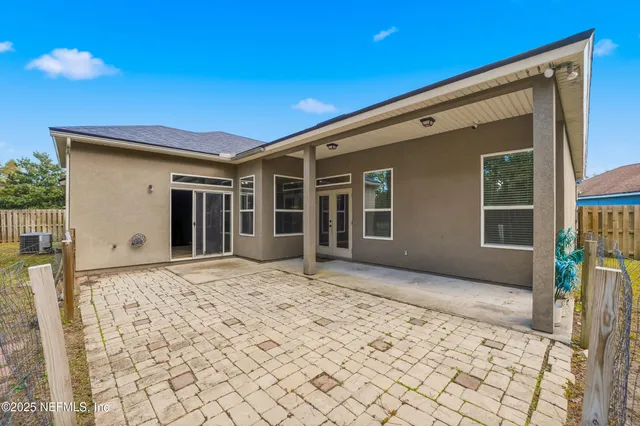 a view of house with backyard