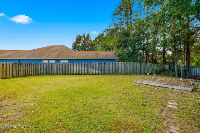 a view of a swimming pool with an outdoor space and seating area