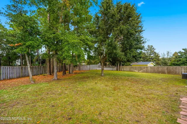 a swimming pool with wooden fence