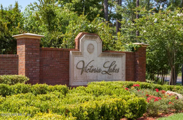 an aerial view of a house with swimming pool and outdoor space