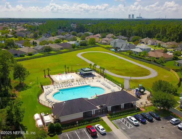 a view of a swimming pool with a yard
