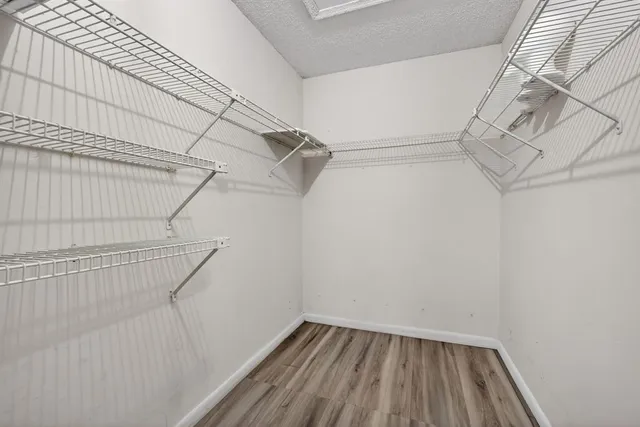 a view of a room with racks on the wall