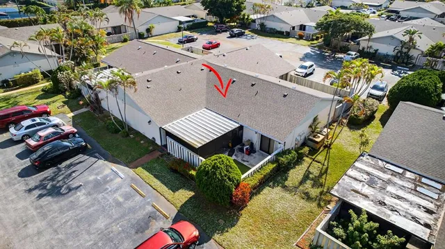 an aerial view of a house with a garden