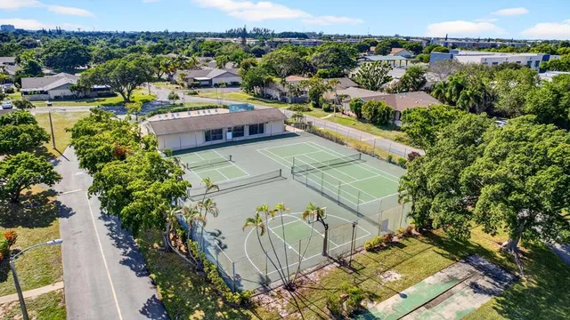 an aerial view of residential houses with outdoor space