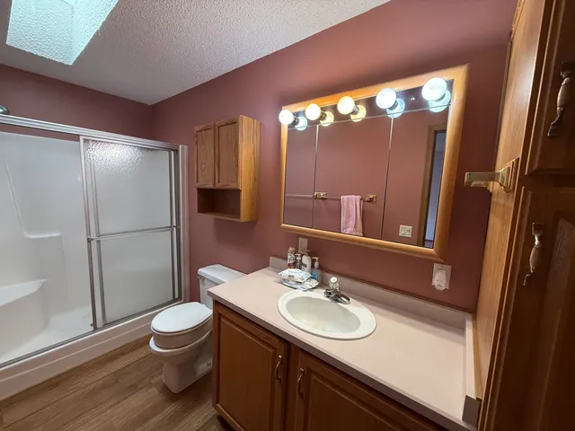 a view of a livingroom with a ceiling fan and window