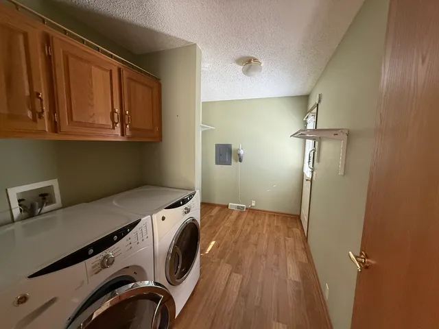 a bathroom with a sink vanity mirror and tub