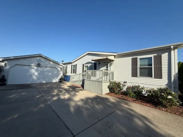 a front view of a house with yard