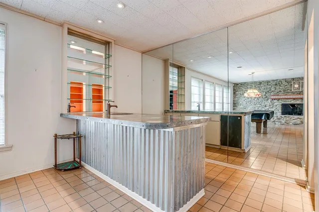 a view of a kitchen with a sink and a window